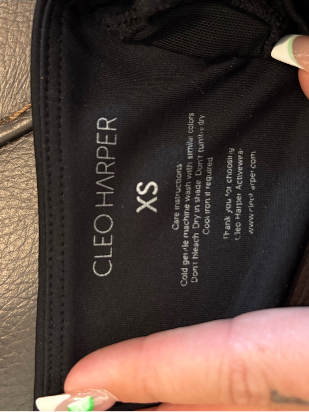 Cleo Harper Black Top with Gold Logo Plaque